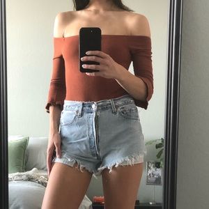 Burnt orange off shoulder bodysuit